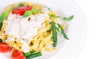 Italian pasta with pesto and herbs.