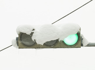 Traffic light in the snow. Stock Image macro.
