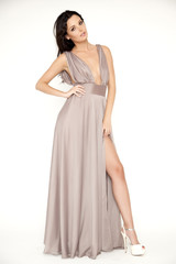 Young slim sexy woman in brown dress isolaten on white backgroun