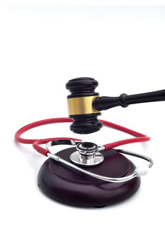 GAVEL WITH A STETHOSCOPE ON THE BASE