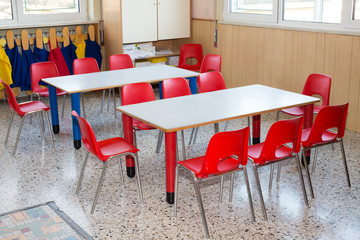 classroom nursery with chairs and desks for children