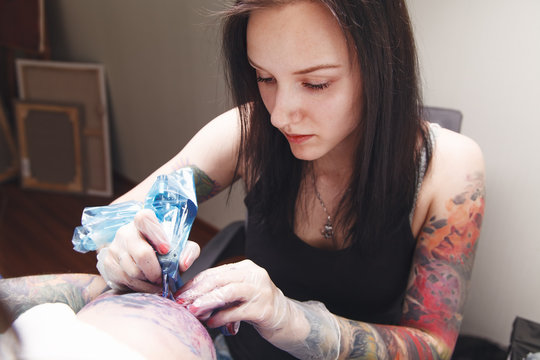 Girl tattoo artist