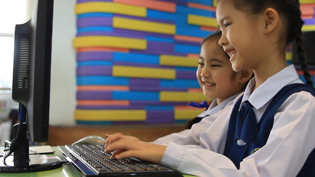Little Asian children study in computer class