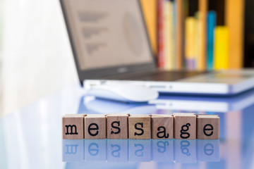 Message word on glass table with reflection