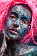 Fashion portrait of stylish bright girl with pink wig