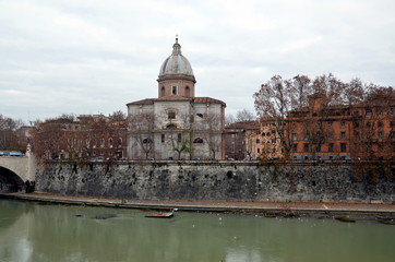 View on Cathedral on the Tiber river on  cloudy day. Rome, Italy