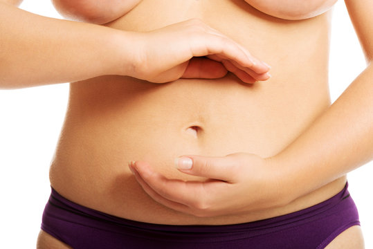 Woman's fat belly in underwear