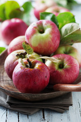 Fresh sweet red apples on the wooden table, selective focus