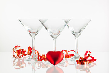 Three glasses of champagne and love symbol