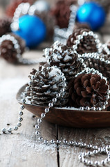 Christmas card with cones, selective focus