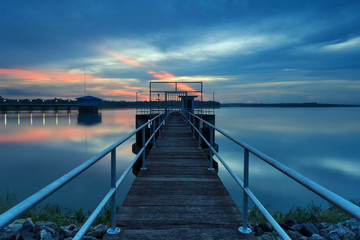 Fototapeta premium The long bridge toward to pump house at reservoir ,Thailand