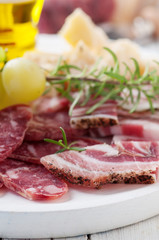 Italian antipasto with sausage, cheese and grapes