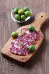 Fresh italian sausage on the wooden table, selective focus