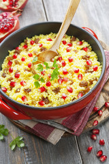 Couscous with pomegranate, raisins and spices