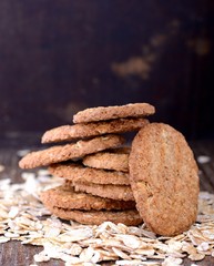 thin oat flakes  crackers on an old wooden background