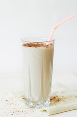milkshake with chocolate topping in glass cup