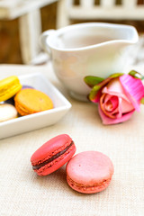 Colorful macaroons and a cup of tea
