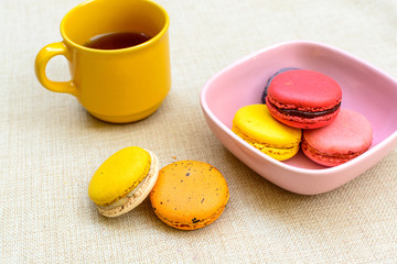 Colorful macaroons and a cup of coffee