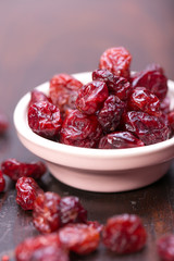 dried cranberries in a wooden spoon. fruit full of vitamin c. 