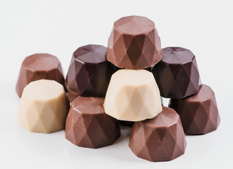 chocolate bonbons on white base