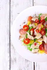 Fresh fish salad with vegetables