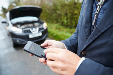 Motorist Broken Down On Country Road Phoning For Help
