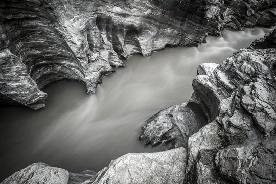 Mountain river running through the rocky canyon. Long exposure b