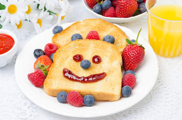 Breakfast with a smiling toast, fresh berries, jam