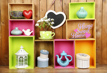 Beautiful colorful shelves with different home related objects