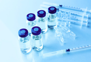 Vaccine in vial with syringe