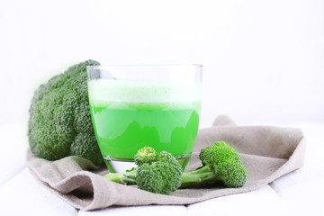 Glass of green smoothie with broccoli