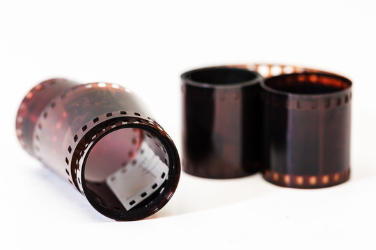 Photographic film. Film reel on white. - Powered by Adobe