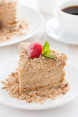 piece of cake with custard and raspberry on a plate