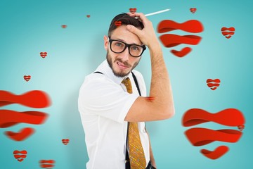 Composite image of geeky hipster scratching his head