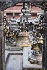 Fototapeta na wymiar Bells - element of the decor, Swayambhunath Stupa in Kathmandu,