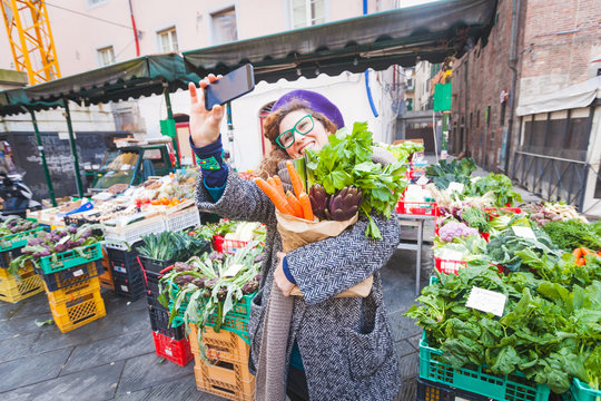 Young Woman Taking a Selfie at Vegetables Market