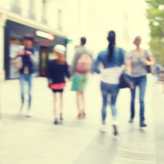 Blurred image of people in the city.