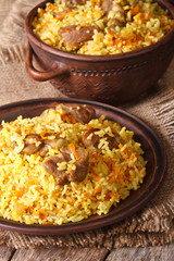 pilaf with meat and vegetables closeup vertical
