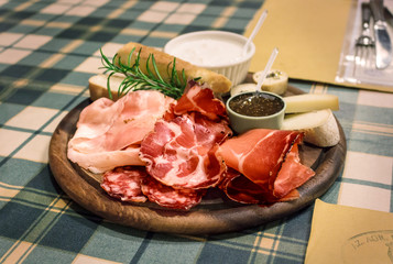 Italian restaurant. Appetizer of ham and chees