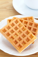 Delicious sweet waffle in ceramic plate on white plate