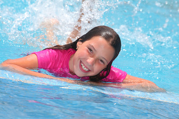 happy girl in a swimming pool