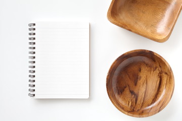 Blank open notebook and kitchen utensils for recipes