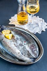 Fresh trouts in ice on the vintage metal tray