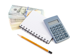 Bundle of dollars, calculator and notebook on a white background