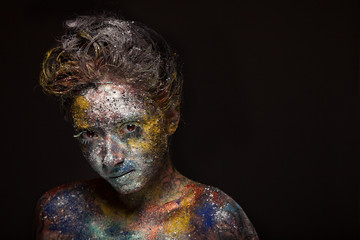 Glitter makeup on a beautiful woman face.