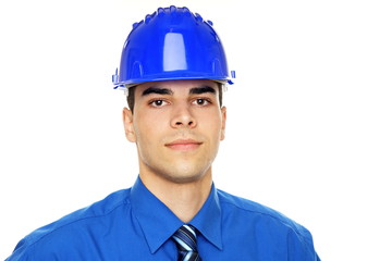 Portrait of young businessman in a protective helmet