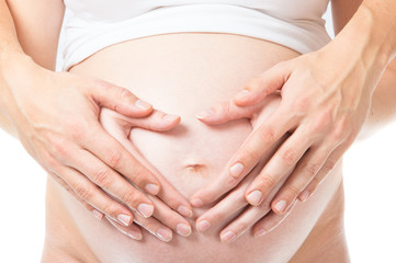 Fototapeta na wymiar Hands over pregnant woman belly