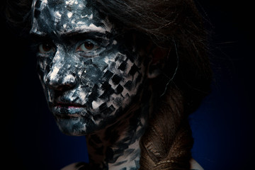 art photo of a beautiful woman with black and white face art