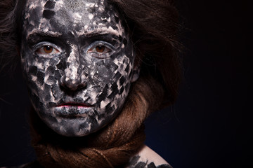 art photo of a beautiful woman with black and white face art
