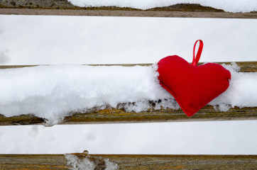 Heart on a snow covered bench